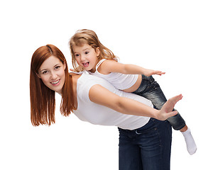 Image showing happy mother and child doing piggy back