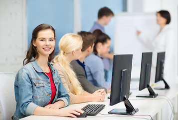 Image showing smiling teenage girl with classmates and teacher