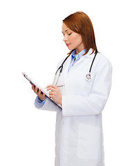 Image showing smiling female doctor with clipboard