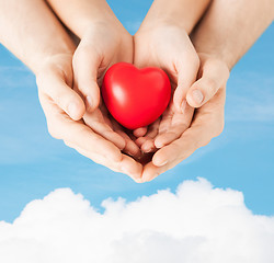 Image showing woman and man hands with heart