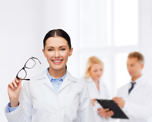 Image showing smiling female doctor with eyeglasses