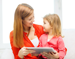 Image showing happy mother and daughter with tablet pc computer