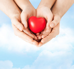 Image showing woman and man hands with heart