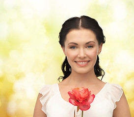 Image showing young and beautiful woman with flower