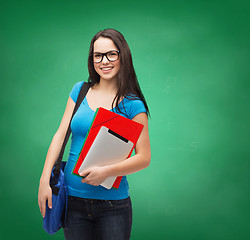 Image showing smiling student with bag, folders and tablet pc