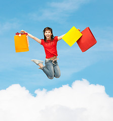 Image showing excited girl with shopping bags