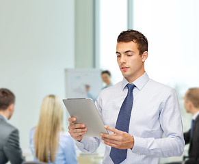 Image showing buisnessman with tablet pc at office