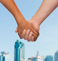 Image showing woman and man holding hands