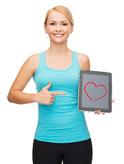 Image showing sporty woman with tablet pc blank screen