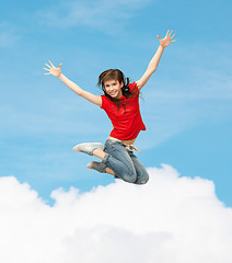 Image showing smiling girl jumping