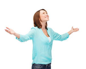 Image showing smiling woman waving hands