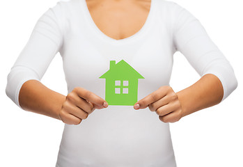 Image showing woman hands holding green house