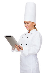 Image showing smiling female chef with tablet pc computer