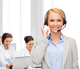 Image showing friendly female helpline operator at office