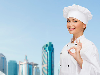 Image showing smiling female chef showing ok hand sign