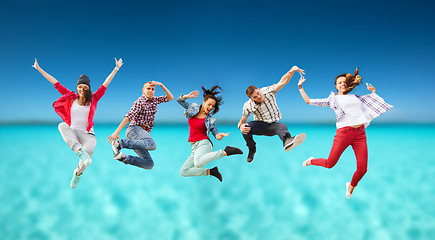 Image showing group of teenagers jumping