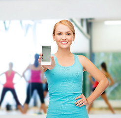 Image showing sporty woman with smartphone