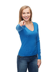 Image showing smiling student pointing finger at you