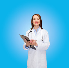 Image showing smiling female doctor with clipboard