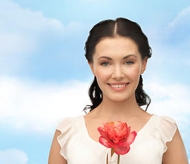 Image showing young and beautiful woman with flower