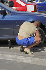 Image showing Changing the wheel