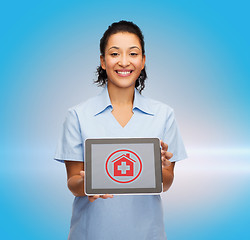 Image showing smiling female doctor or nurse with tablet pc