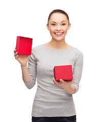 Image showing beautiful girl opening red gift box