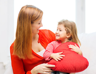 Image showing happy mother and child with big red heart at home