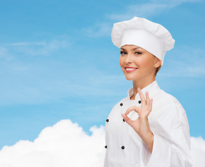 Image showing smiling female chef showing ok hand sign