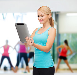 Image showing sporty woman with tablet pc