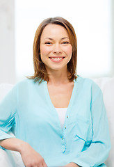 Image showing smiling woman at home