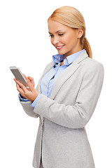 Image showing smiling woman looking at smartphone