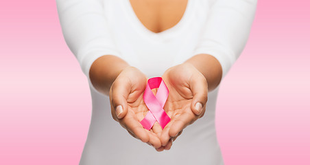 Image showing hands holding pink breast cancer awareness ribbon