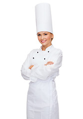 Image showing smiling female chef with crossed arms