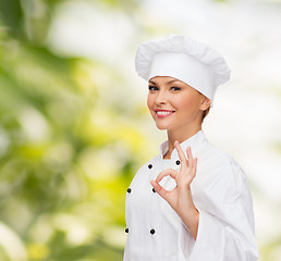 Image showing smiling female chef showing ok hand sign