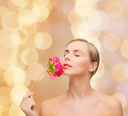 Image showing lovely woman with peonie flower