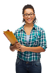 Image showing female black student in eyeglasses with folders