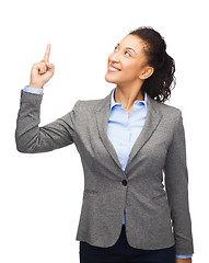 Image showing smiling businesswoman with her finger up