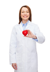 Image showing smiling female doctor with heart