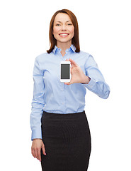 Image showing smiling businesswoman with smartphone blank screen