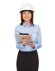 Image showing young smiling businesswoman in white helmet