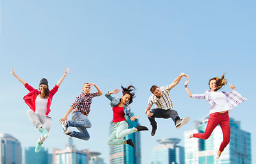 Image showing group of teenagers jumping