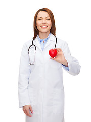 Image showing smiling female doctor with heart and stethoscope