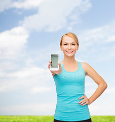 Image showing sporty woman with smartphone