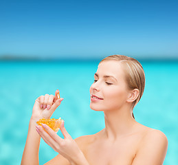 Image showing lovely woman with omega 3 vitamins