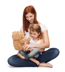 Image showing happy mother with adorable girl and teddy bear