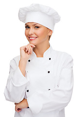 Image showing smiling female chef dreaming