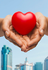 Image showing womans cupped hands showing red heart