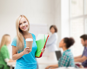 Image showing smiling student with folders