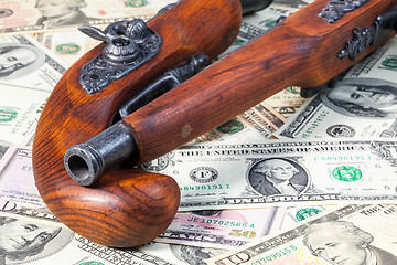 Image showing Old guns and money and money